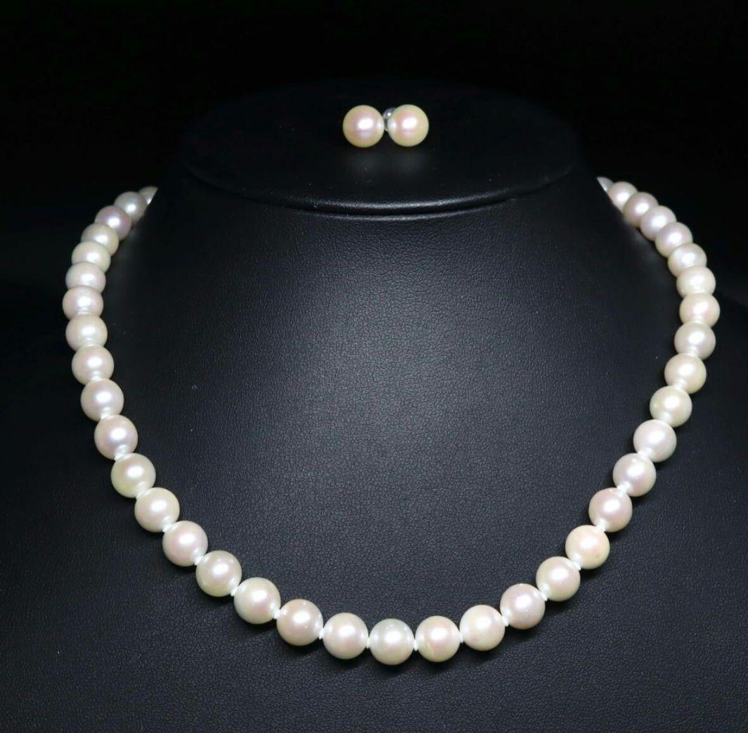 Akoya pearl necklace and earring set featuring 8.5-8.0mm white round pearls with silver fittings