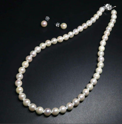 Akoya pearl necklace and earring set featuring 8.5-8.0mm white round pearls with silver fittings