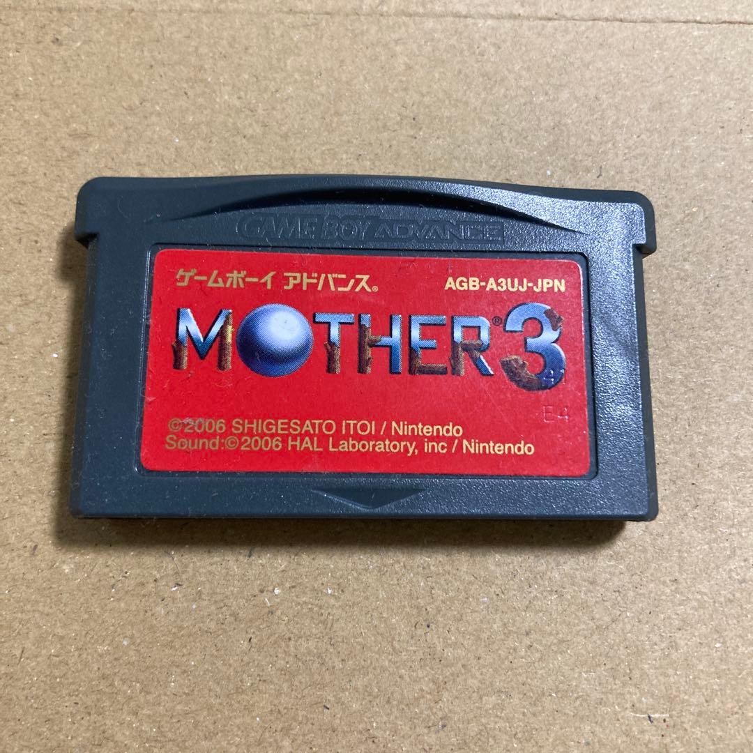 MOTHER3 Game Boy Advance game cartridge with label showing artwork and title