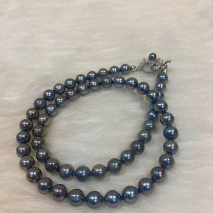 Gray Akoya pearl necklace approximately 43cm long with 6.5-6.9mm pearls and silver clasp