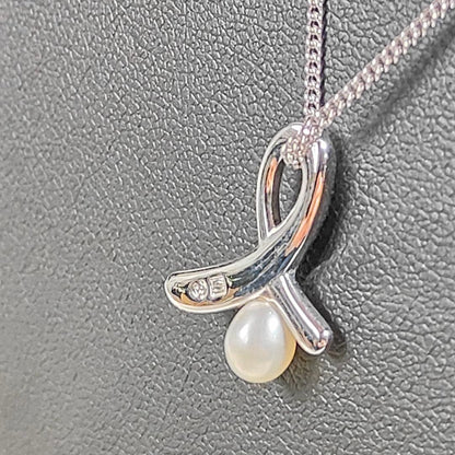 TASAKI pearl necklace with silver ribbon motif and genuine pearls on 40 cm chain