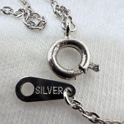 Agete silver pendant necklace featuring a cross rocket design on a 45.5 cm silver chain