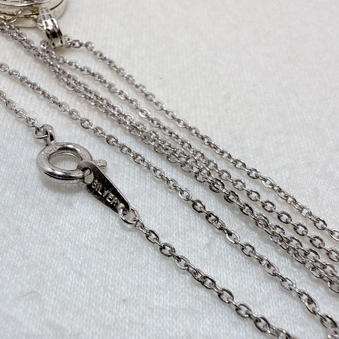 Agete silver pendant necklace featuring a cross rocket design on a 45.5 cm silver chain