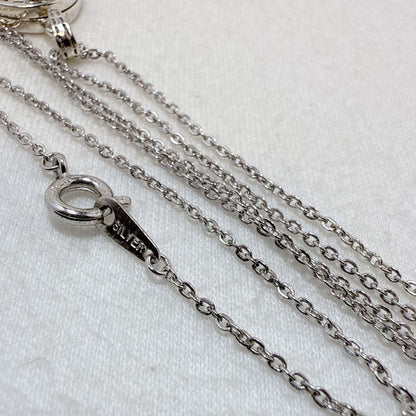 Agete silver pendant necklace featuring a cross rocket design on a 45.5 cm silver chain