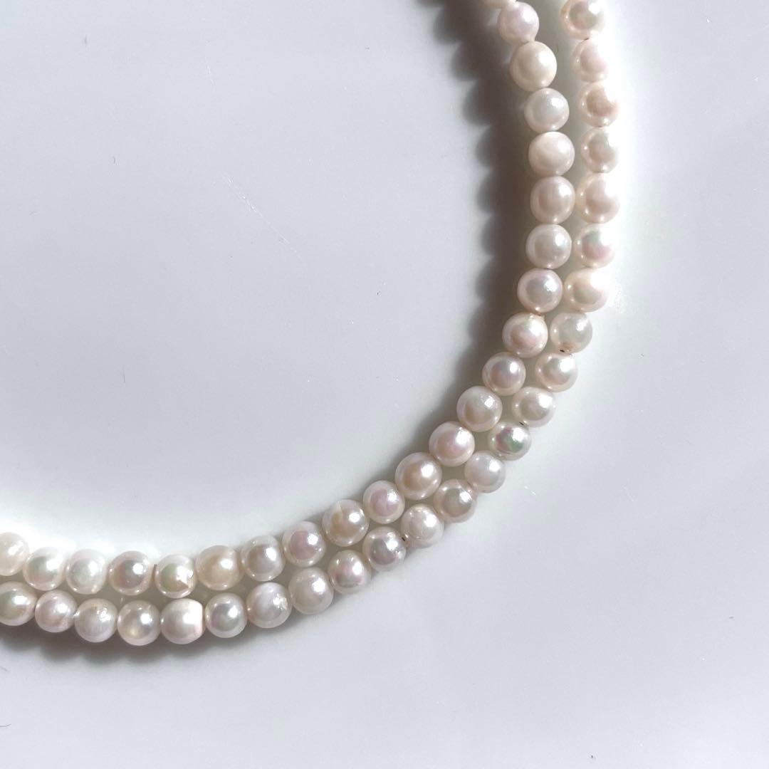 Small K18 Akoya pearl necklace featuring 2.6-3.0mm white pearls with pink and green hues on a 42cm chain