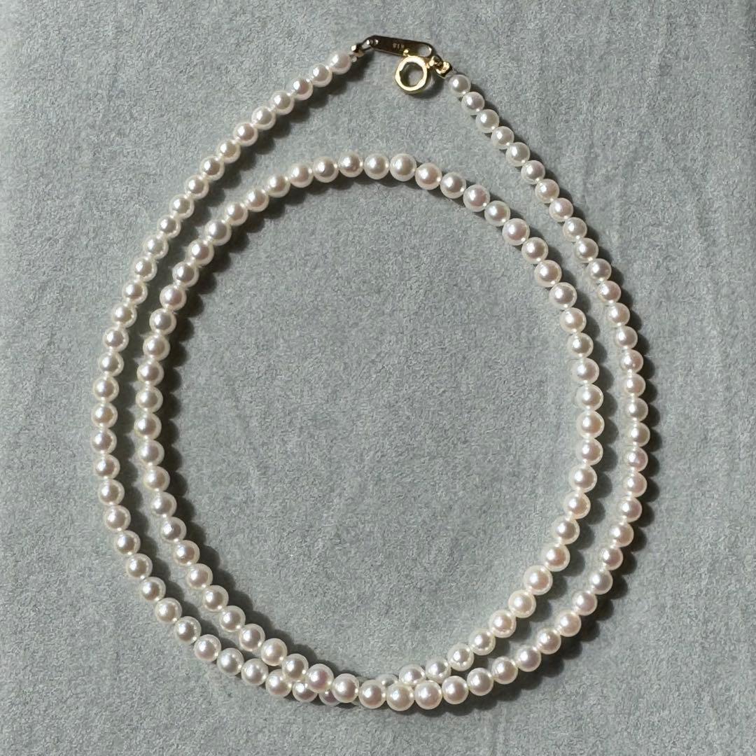 K18 Akoya baby pearl necklace with 3.0-3.5mm pearls and 42 cm length on white background
