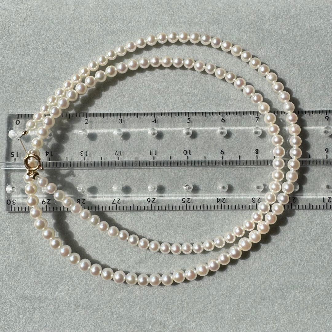 K18 Akoya baby pearl necklace with 3.0-3.5mm pearls and 42 cm length on white background