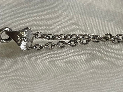 Mikimoto silver pearl necklace with flower motif and 41 cm chain on white background