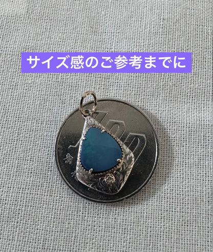 Agete charm made of K10 silver featuring opal and 0.008ct diamond measuring 1.25 by 2.3 cm