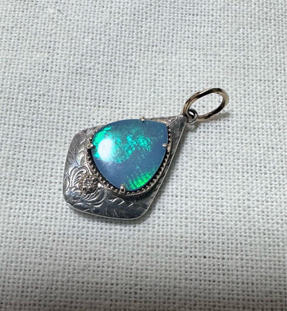 Agete charm made of K10 silver featuring opal and 0.008ct diamond measuring 1.25 by 2.3 cm