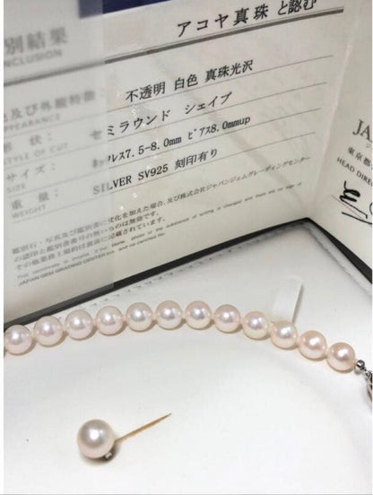 Akoya pearl necklace with 7.5-8mm pearls and matching 8mm silver earrings on white background