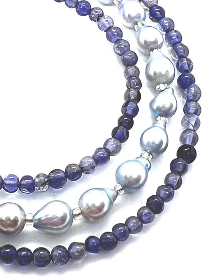 Akoya pearl necklace featuring natural blue baby pearls and small iolite stones on a 41 to 46 cm chain
