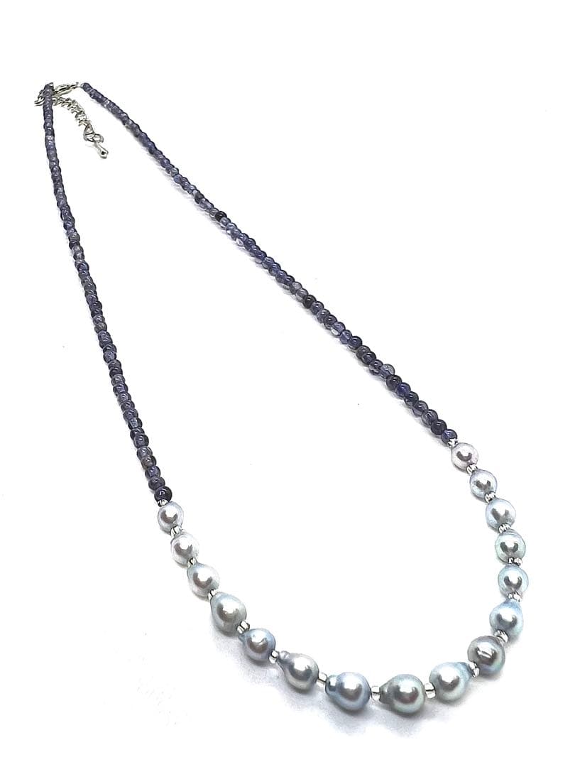 Akoya pearl necklace featuring natural blue baby pearls and small iolite stones on a 41 to 46 cm chain