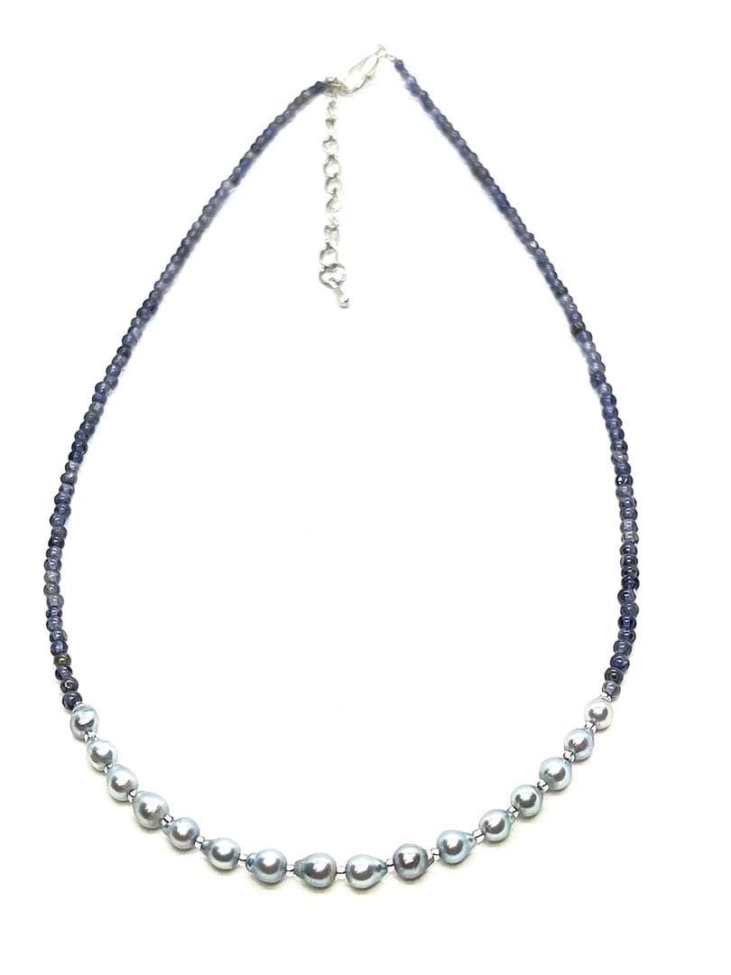 Akoya pearl necklace featuring natural blue baby pearls and small iolite stones on a 41 to 46 cm chain