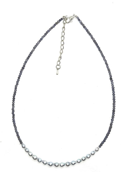 Akoya pearl necklace featuring natural blue baby pearls and small iolite stones on a 41 to 46 cm chain
