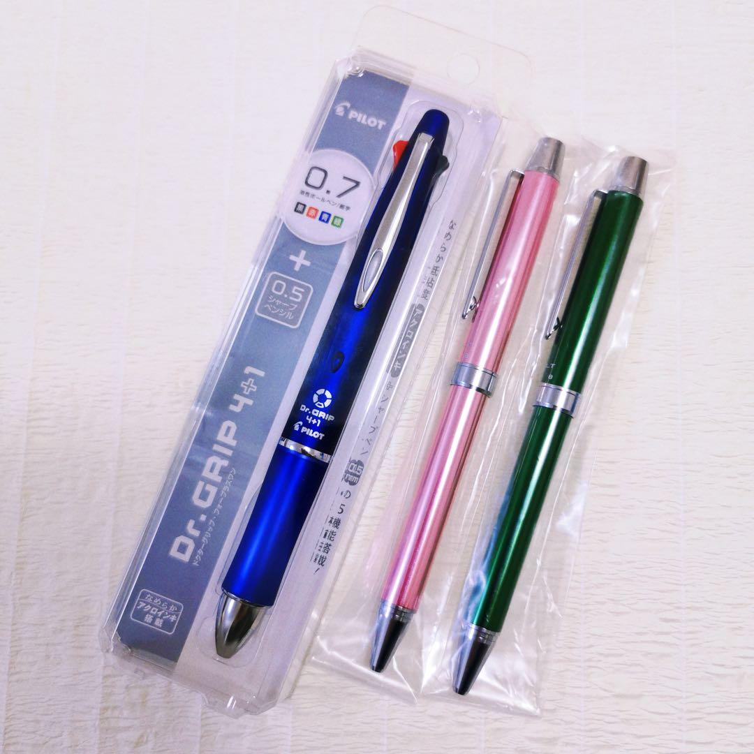 Set of three Pilot multi-function pens including two EVOLT 2+1 pens and one Dr.Grip 4+1 navy pen