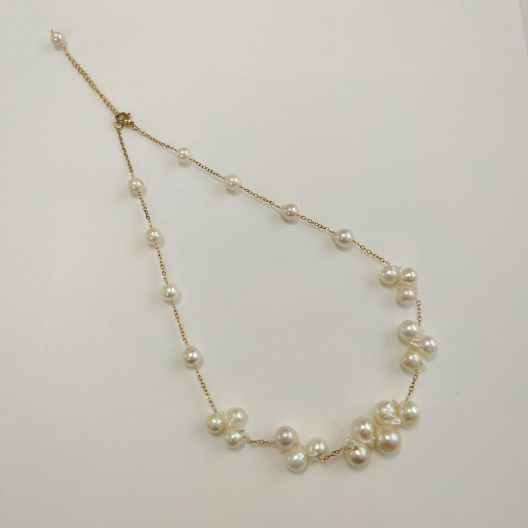 Akoya pearl necklace with flower-shaped pearls in gold color on stainless steel chain