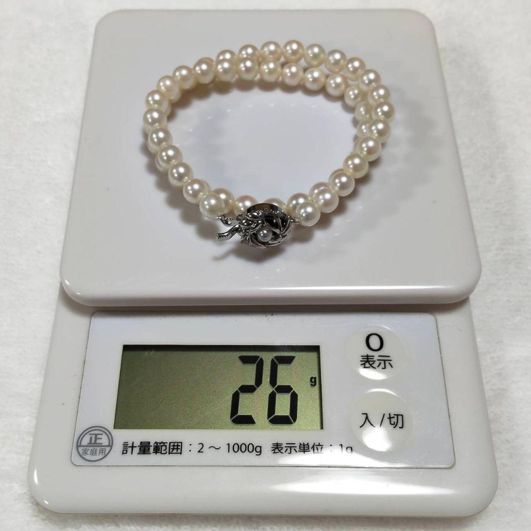 Akoya pearl necklace with 7mm round pearls and silver marking, 36cm length, displayed on white background