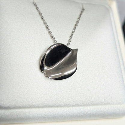 Mikimoto silver necklace pendant with petal metal design on a 50 cm chain