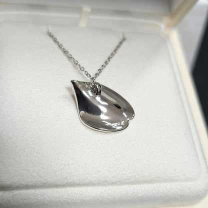 Mikimoto silver necklace pendant with petal metal design on a 50 cm chain