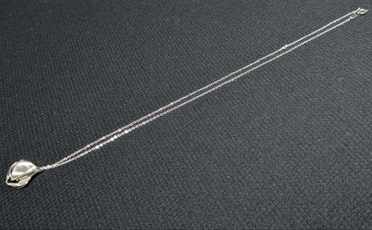 Mikimoto silver necklace pendant with petal metal design on a 50 cm chain