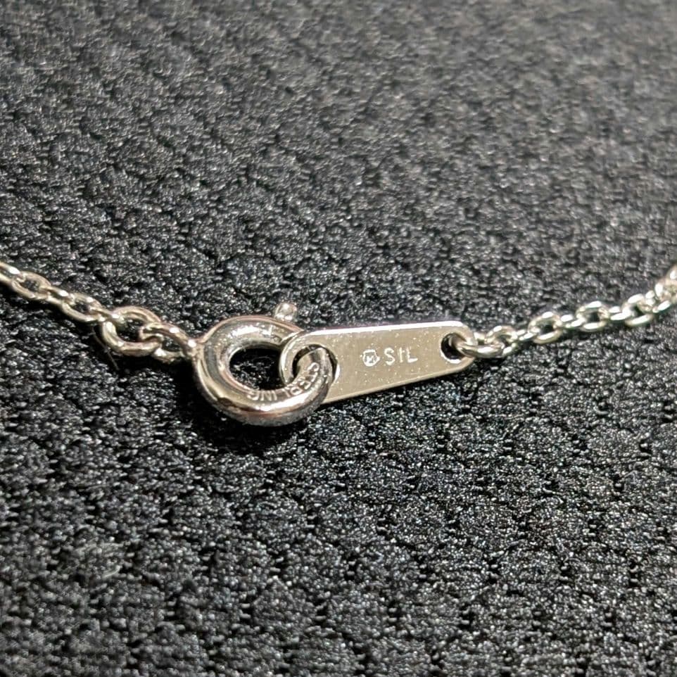 Mikimoto silver necklace pendant with petal metal design on a 50 cm chain