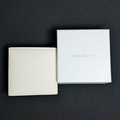 Mikimoto silver necklace pendant with petal metal design on a 50 cm chain