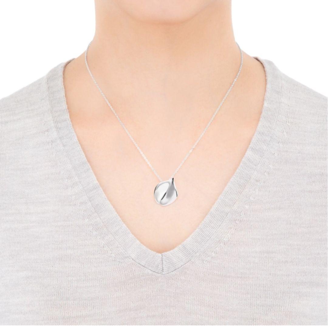 Mikimoto silver necklace pendant with petal metal design on a 50 cm chain