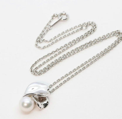 Mikimoto Silver Vendome Petal Necklace featuring a single pearl on silver petals, displayed on white background