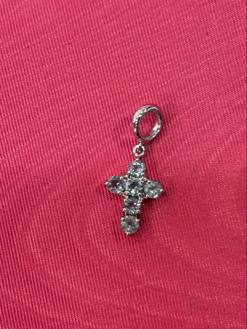 TASAKI silver cross pendant necklace with engraved design on a delicate chain