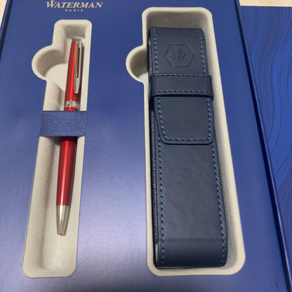 Unused Waterman red ballpoint pen paired with a blue pen case