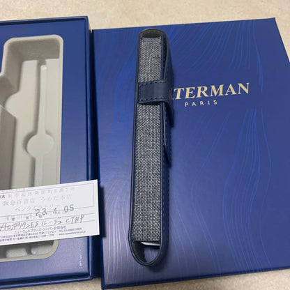 Unused Waterman red ballpoint pen paired with a blue pen case