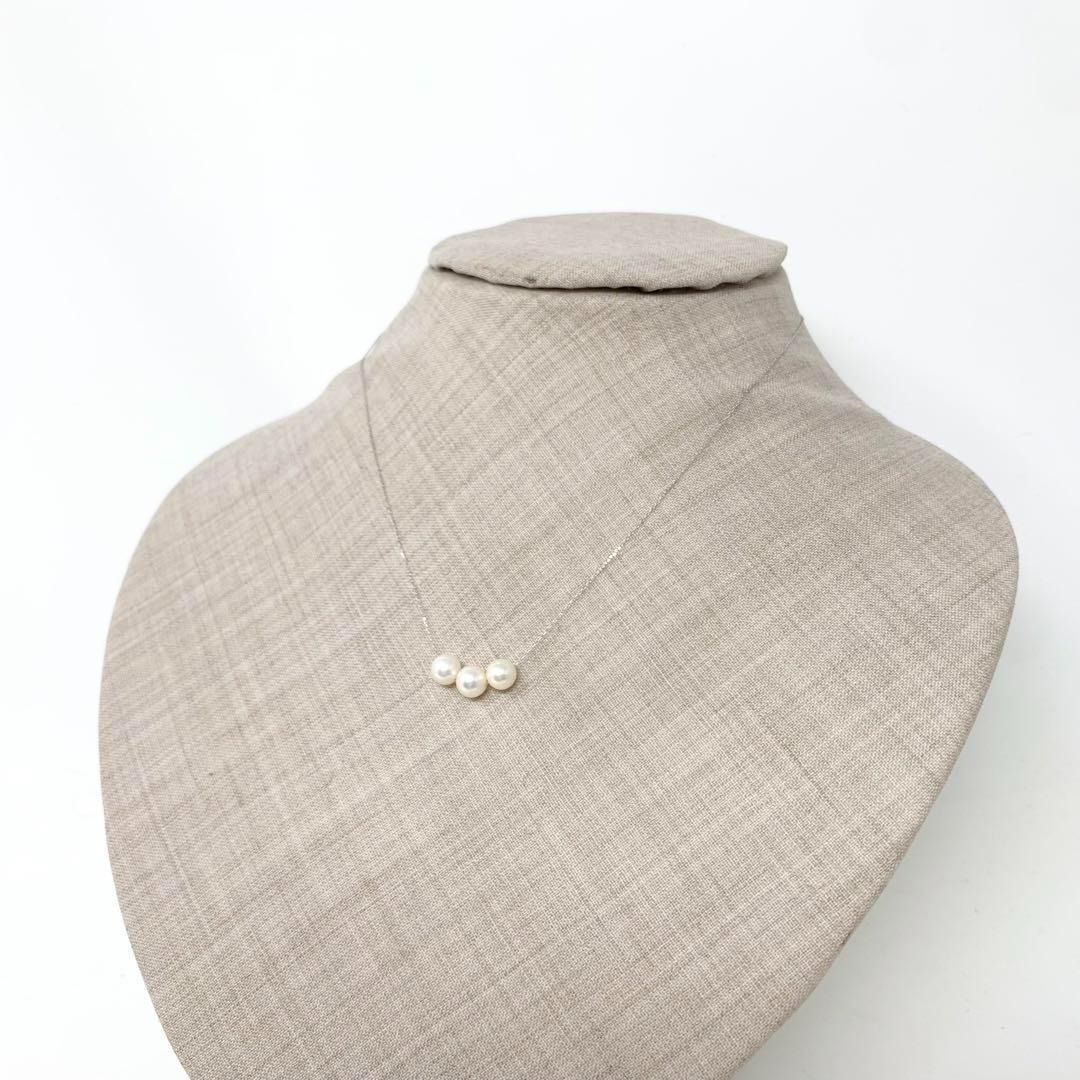 Platinum 6.5mm three-row Akoya pearl necklace with a 40cm chain displayed on a white background