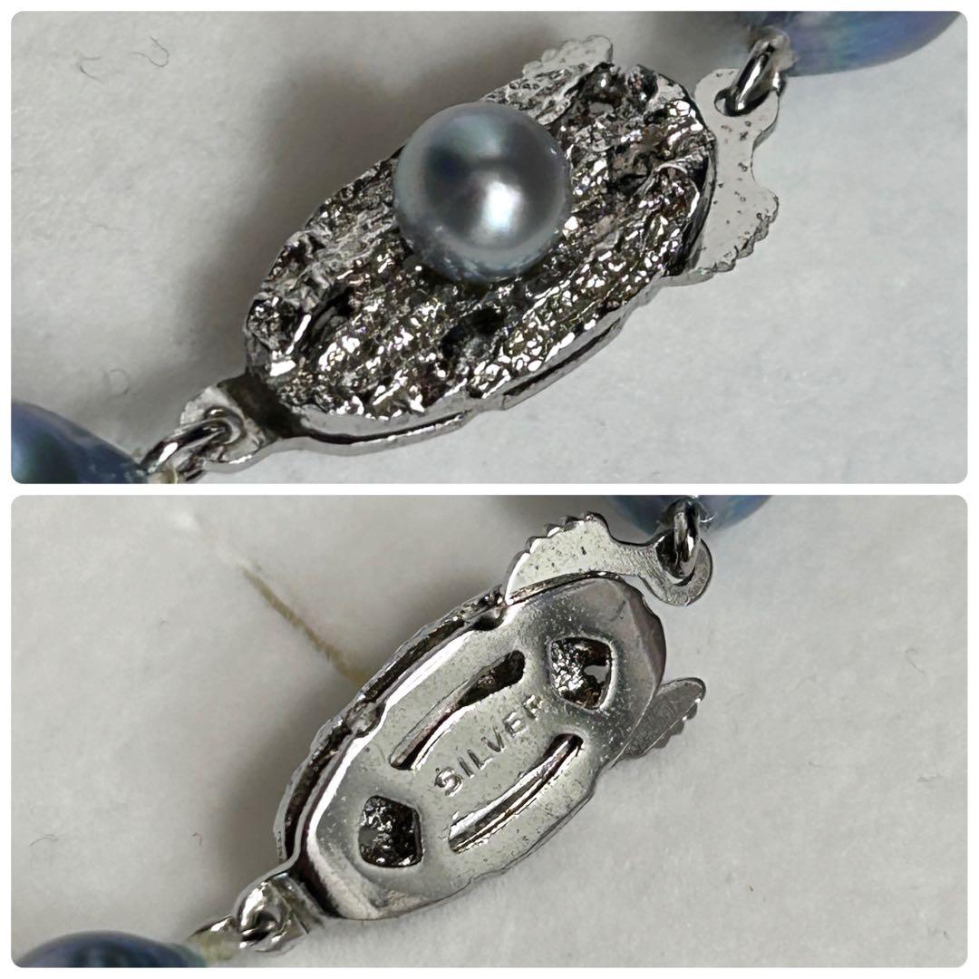 Akoya pearl necklace featuring baroque pearls with blue tint, 8.9mm size, 55.5cm length, silver clasp