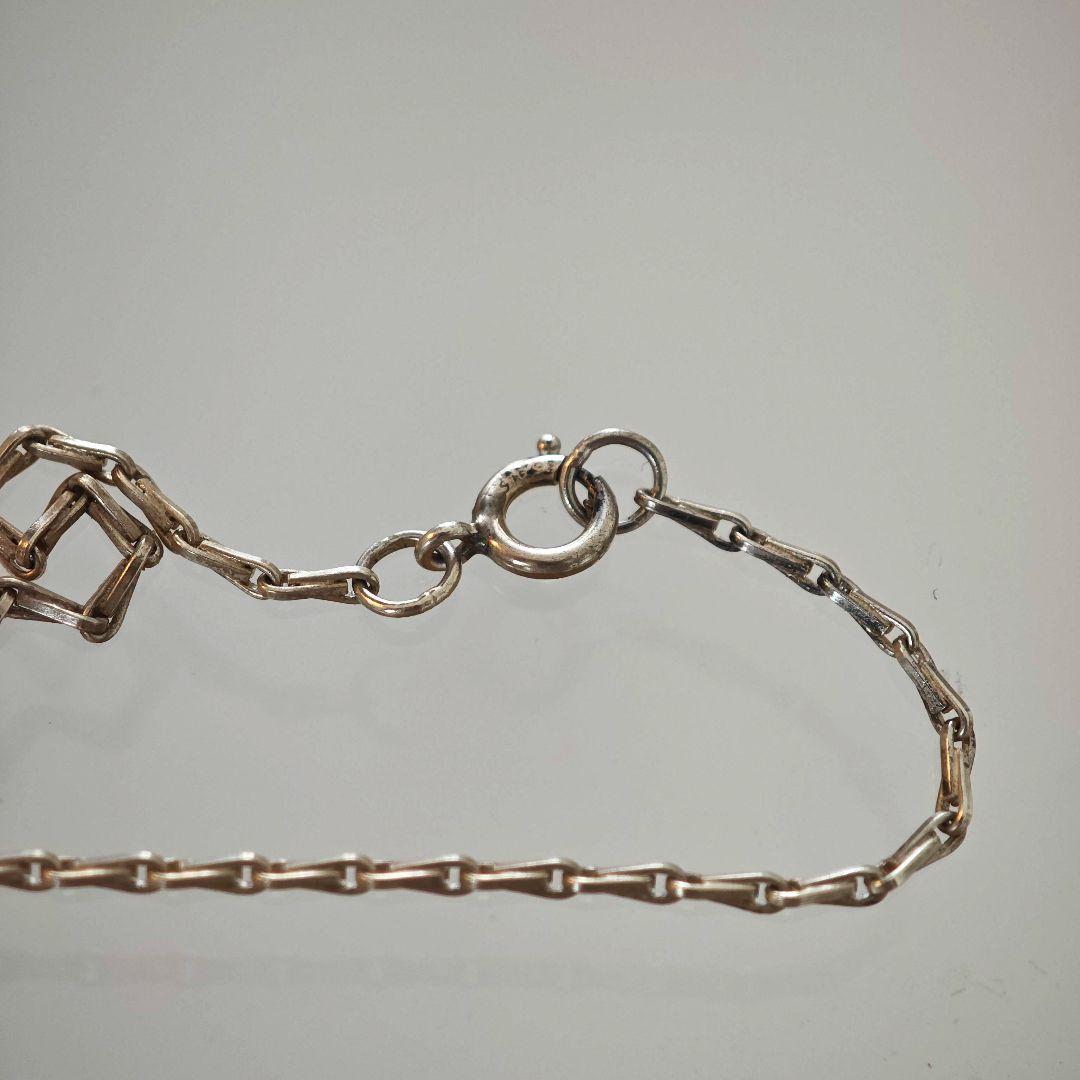 Agete silver necklace with 2.9cm shell and metal filigree charm on a 50cm chain