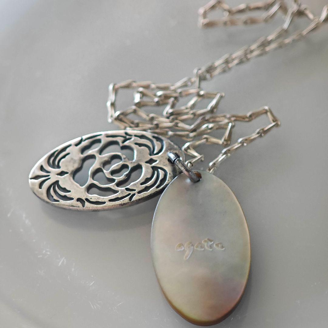 Agete silver necklace with 2.9cm shell and metal filigree charm on a 50cm chain