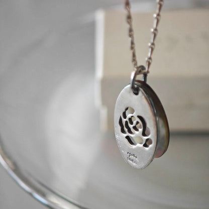 Agete silver necklace with 2.9cm shell and metal filigree charm on a 50cm chain