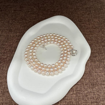 A grain Akoya pearl necklace with baroque pearls measuring 7-7.5mm and 83cm length