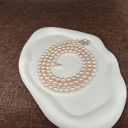 A grain Akoya pearl necklace with baroque pearls measuring 7-7.5mm and 83cm length