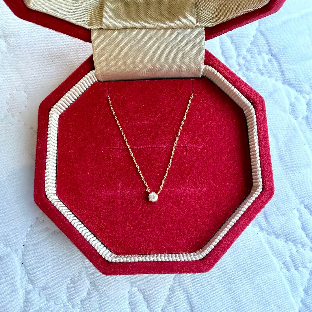 agete K18 gold necklace featuring a single 0.03ct diamond with dedicated box