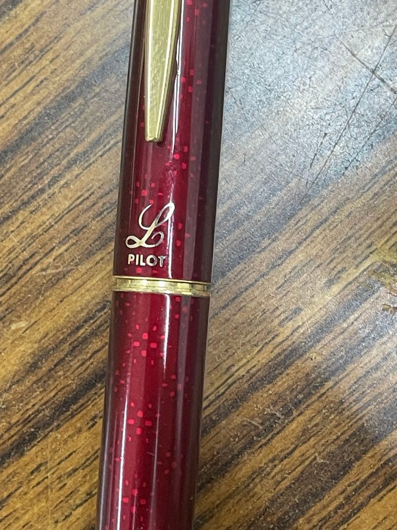 PILOT burgundy fountain pen with 14K gold fine nib displayed on white background