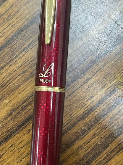 PILOT burgundy fountain pen with 14K gold fine nib displayed on white background