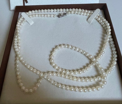 Akoya genuine pearl necklace with 5mm round white pearls measuring 114cm in length