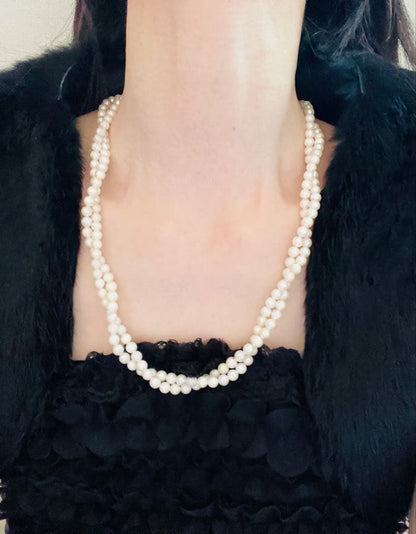 Akoya genuine pearl necklace with 5mm round white pearls measuring 114cm in length