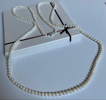 Akoya genuine pearl necklace with 5mm round white pearls measuring 114cm in length