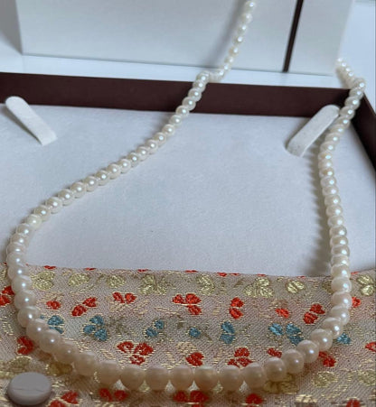 Akoya genuine pearl necklace with 5mm round white pearls measuring 114cm in length