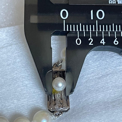Akoya genuine pearl necklace with 5mm round white pearls measuring 114cm in length