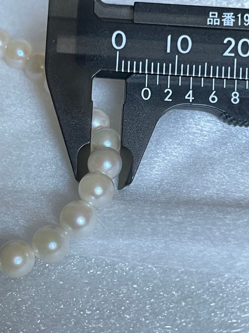 Akoya genuine pearl necklace with 5mm round white pearls measuring 114cm in length