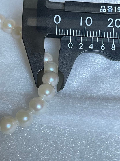 Akoya genuine pearl necklace with 5mm round white pearls measuring 114cm in length
