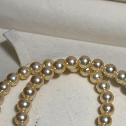Tasaki Golden Pearl Akoya pearl necklace with 7.0-7.5 mm pearls and silver clasp on a 43 cm chain